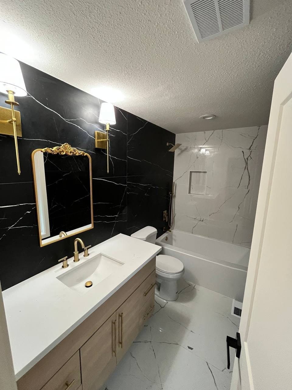Black Marble-Look Bath with Brass