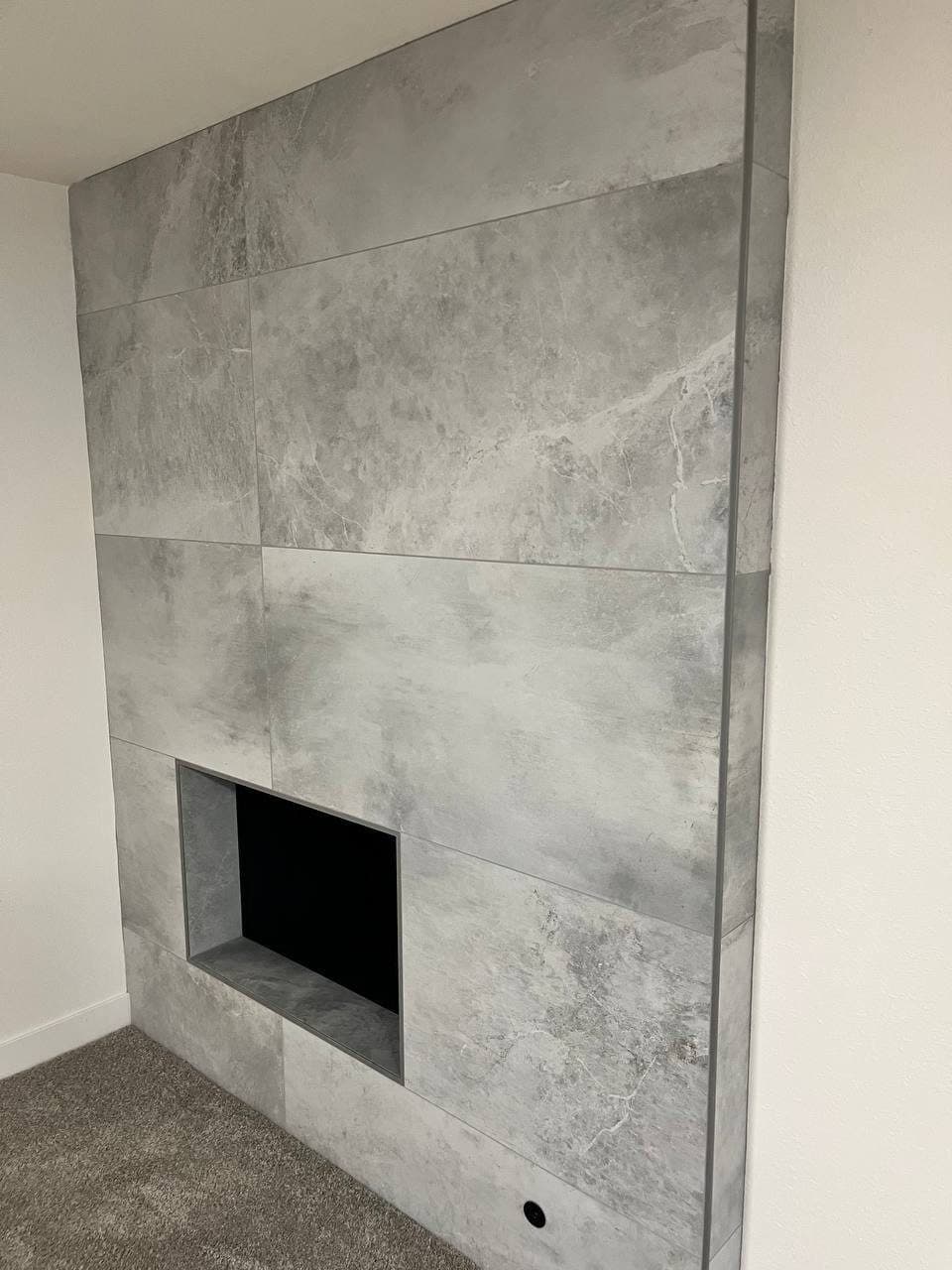 Fireplace Wall in Large-Format Porcelain